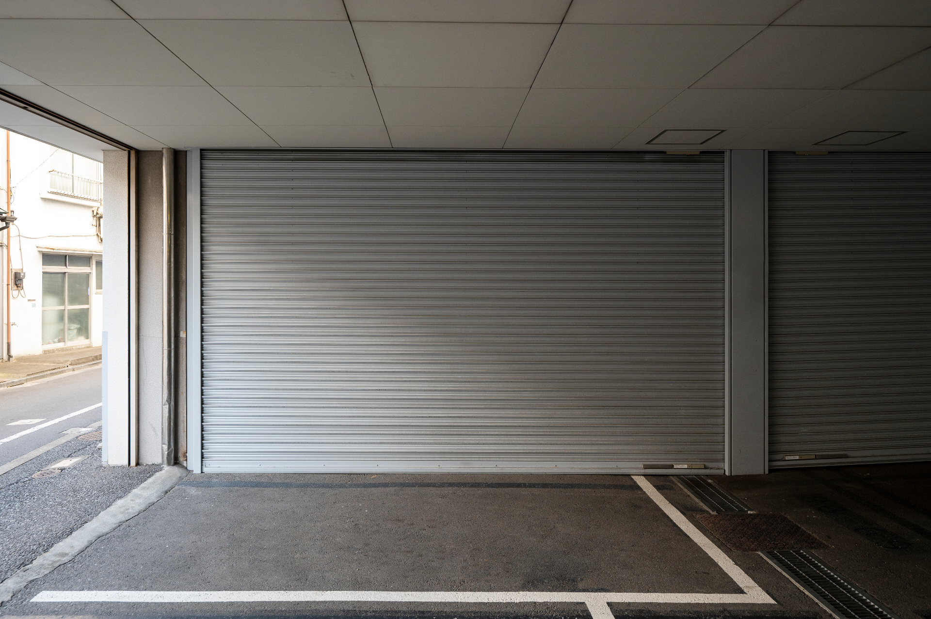 Commercial rollup garage door service at a storefront