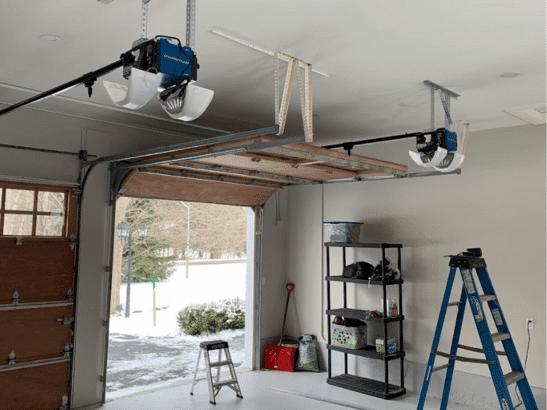 Garage door opener motor housing with drive belt and logic board