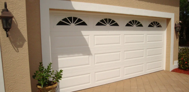 Residential garage door installation with insulated steel panels
