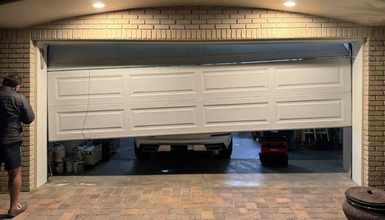 Comparison of old worn garage door next to a new modern insulated door
